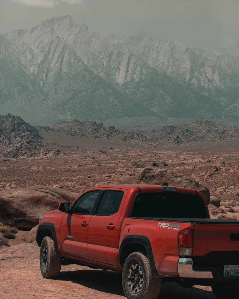 Red Tacoma on a scenic trail