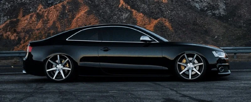 Black Audi with blacked-out windows
