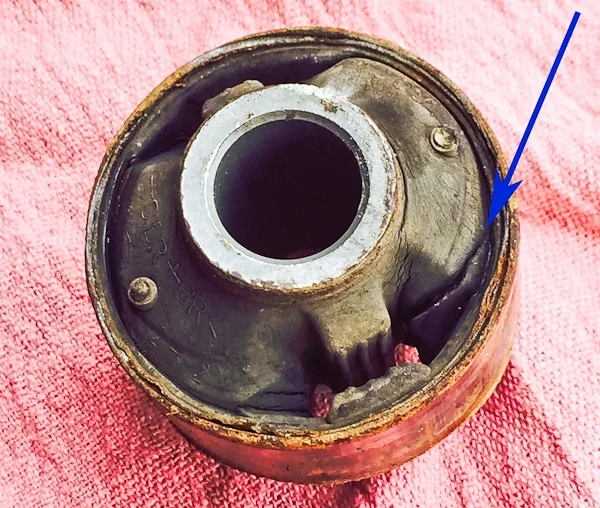 Worn out control arm bushing