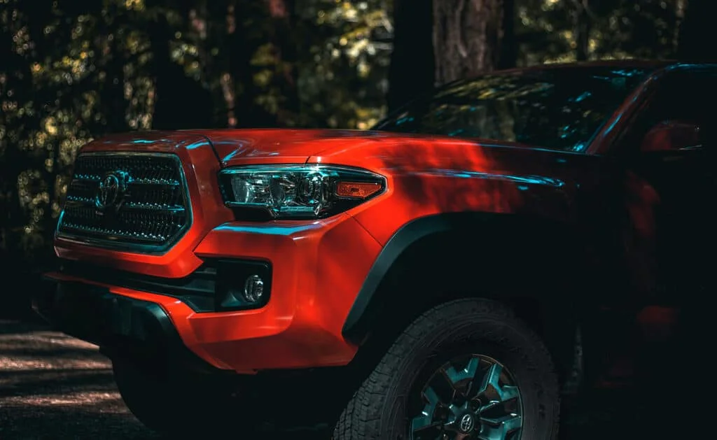 Red Tacoma with chrome grille