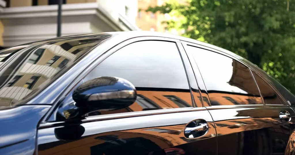 Black sedan with black tinted windows in Georgia