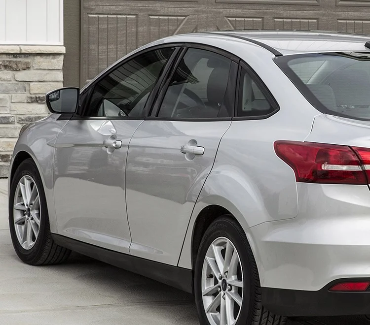 A silver crossover with tinted windows