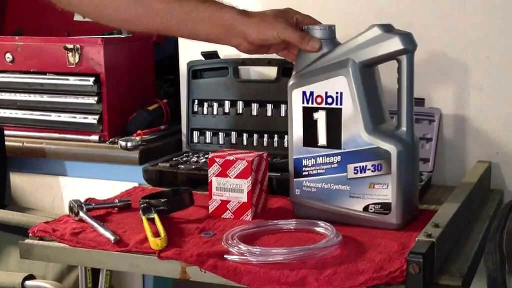 A container for Mobil1 5W-30 engine oil and other tools