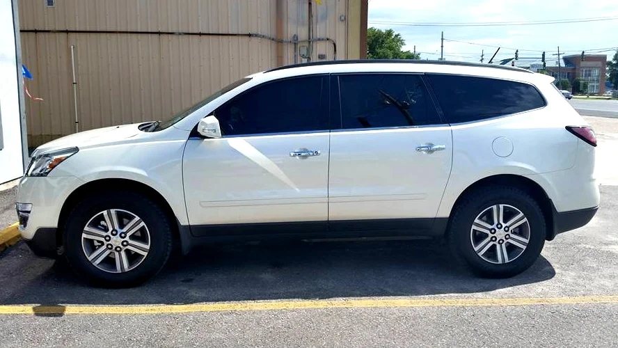 White SUV with black window tint in Illinois.