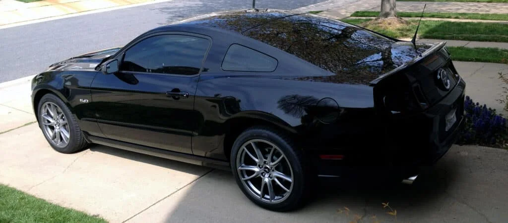 All-black Mustang with dark black window tint