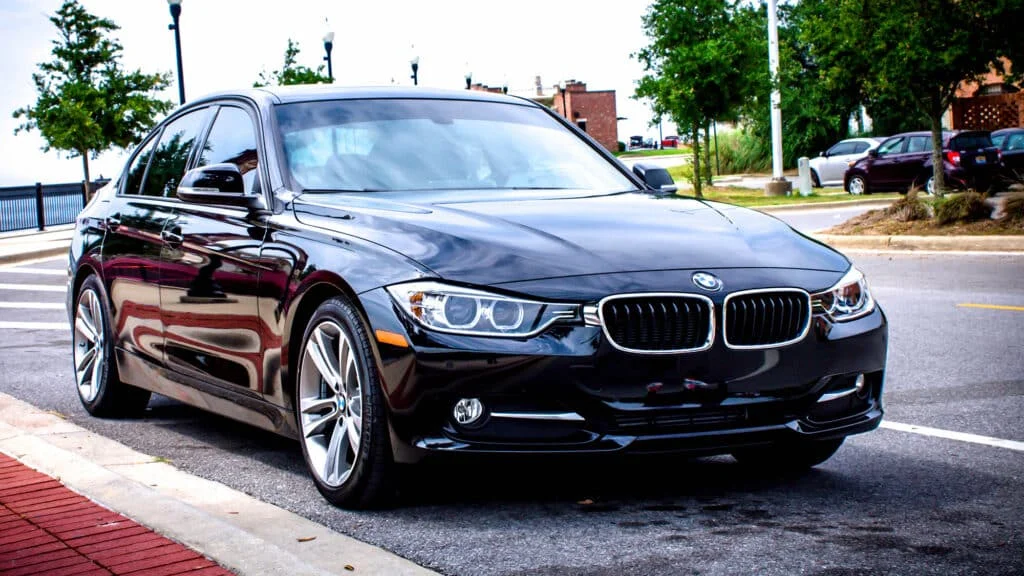 Black BMW sedan with dark tinted windows