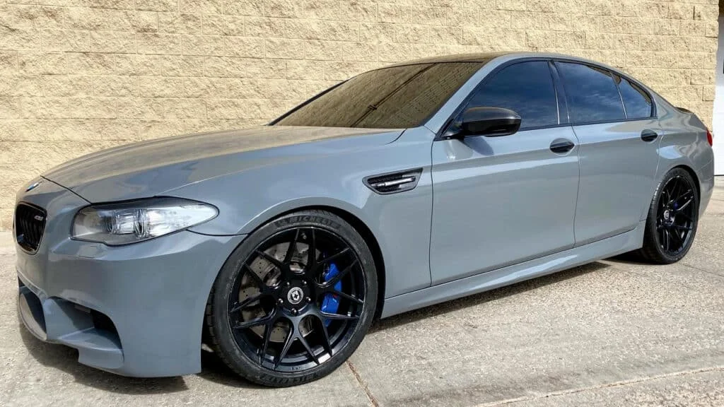 BMW 5-series sedan with black tinted windows