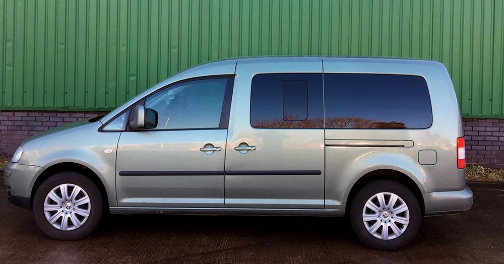VW minivan with dark black tinted windows