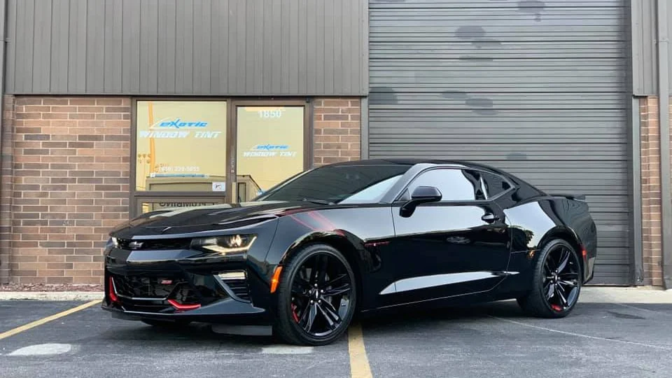 Black Mustang with reflective black windows