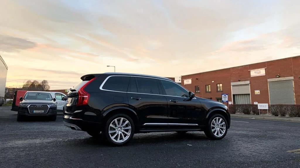 Volvo SUV with dark black window tint and chrome trim