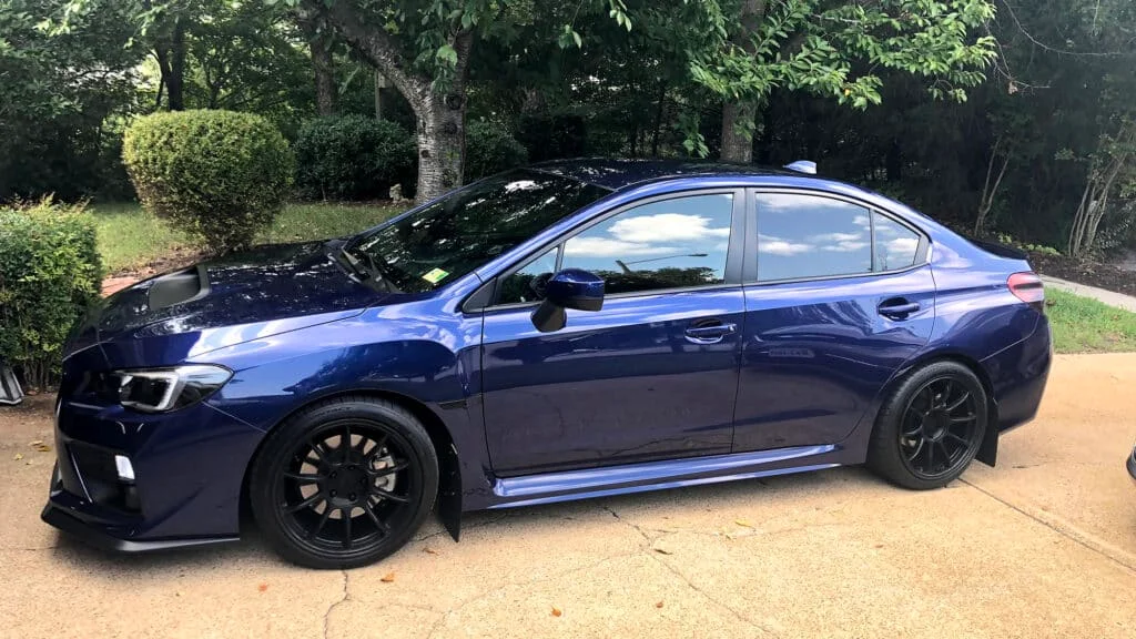 Dark blue WRX with reflective tinted windows