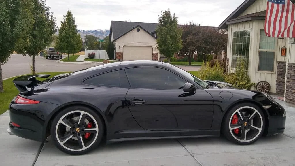 Black Porsche 911 turbo with black tinted windows
