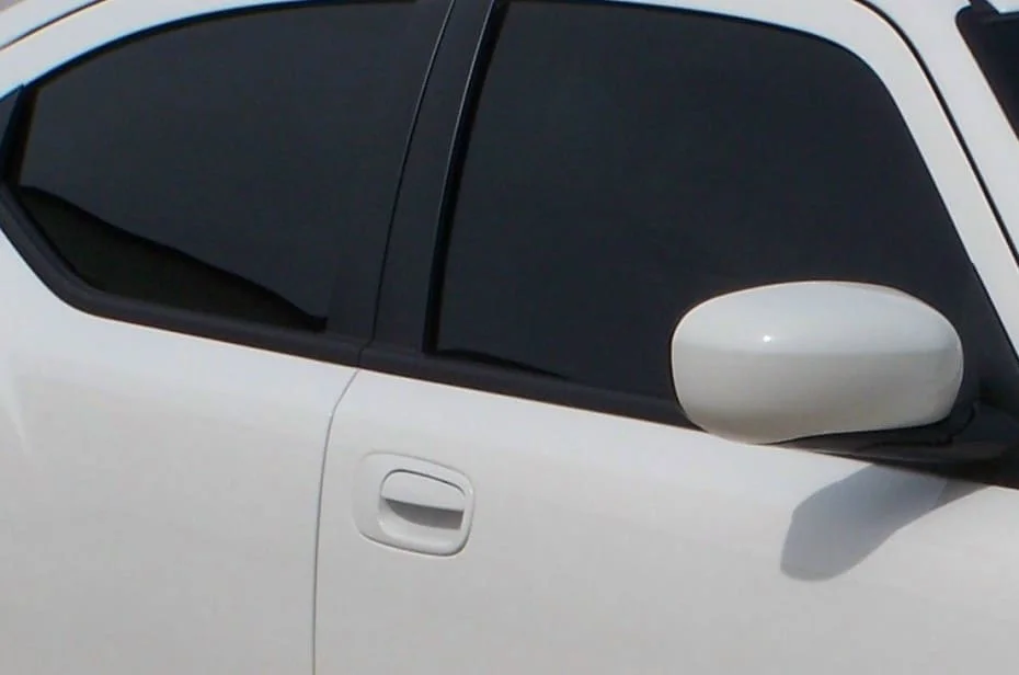White sedan with dark black windows in Mississippi
