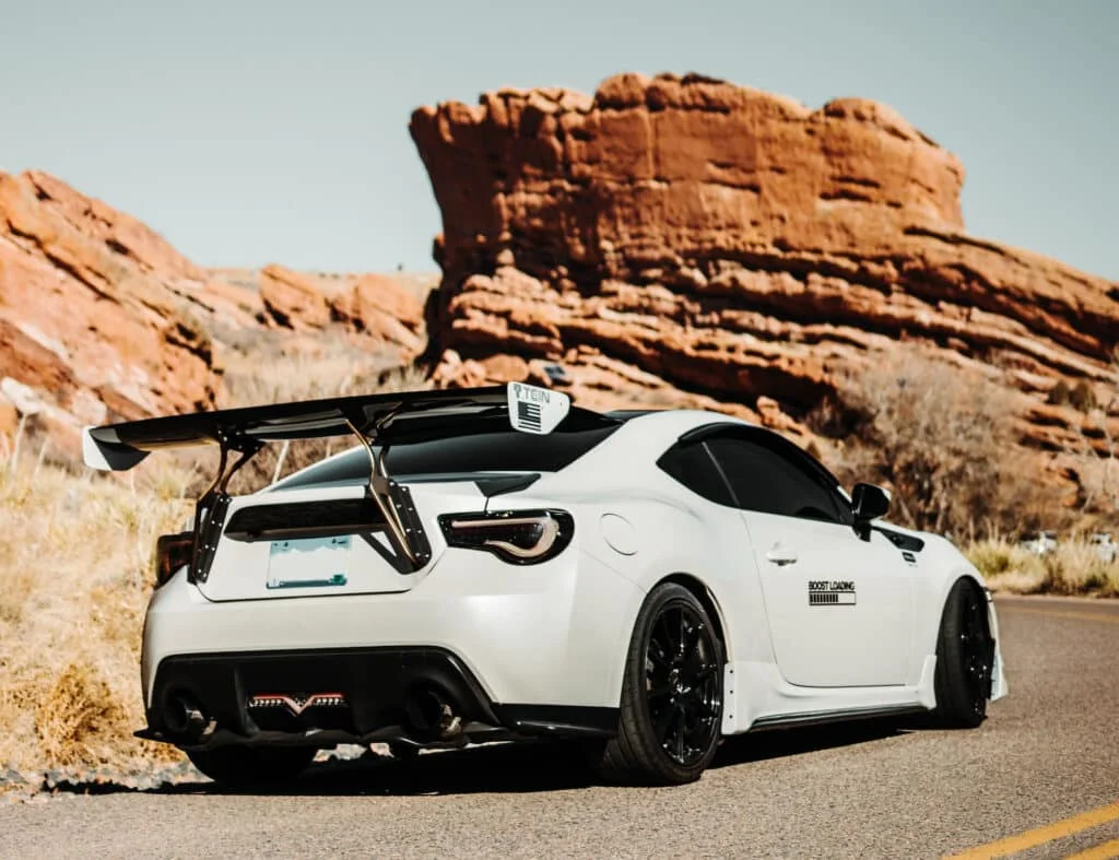White Scion FRS with a big wing