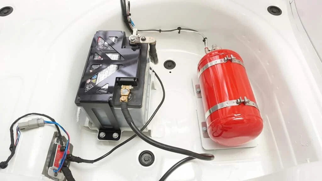 Fire extinguisher kit plumbed into a race car