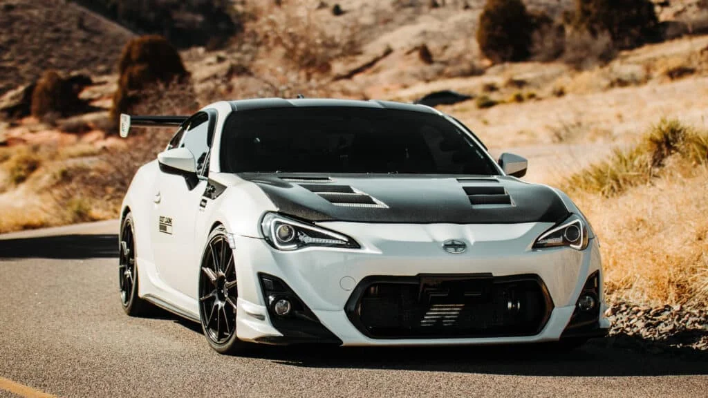 White Scion FRS with carbon fiber hood