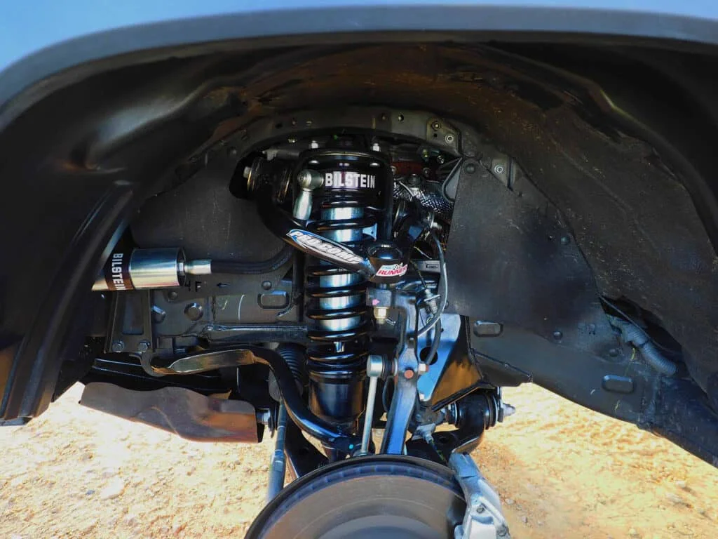 Aftermarket coilovers installed on a Tacoma