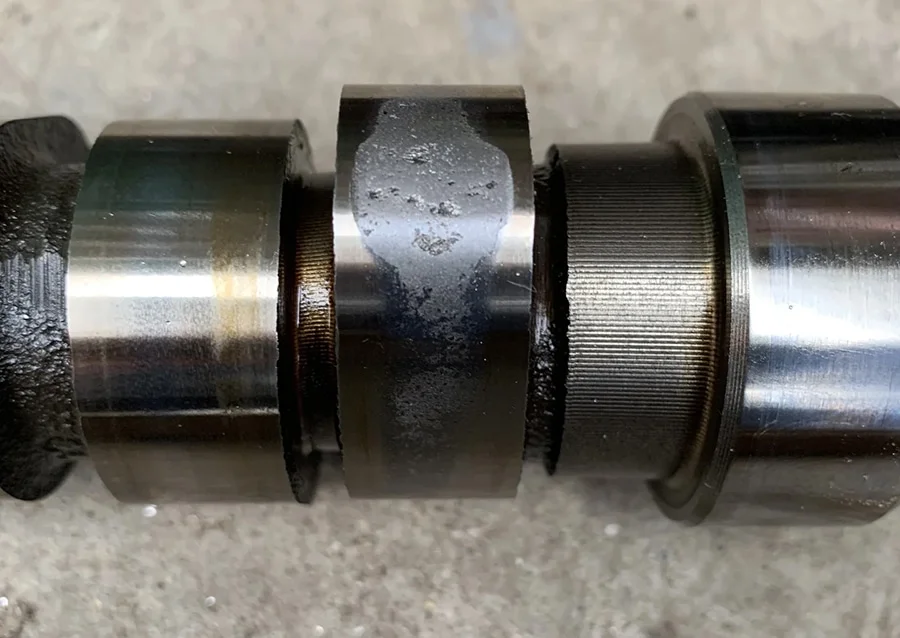 Pitted cam lobes