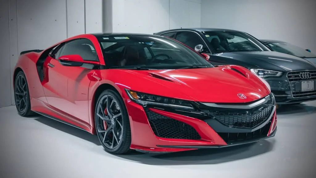 2018 Acura NSX parked next to an Audi
