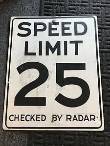 Speed checked by radar warning sign