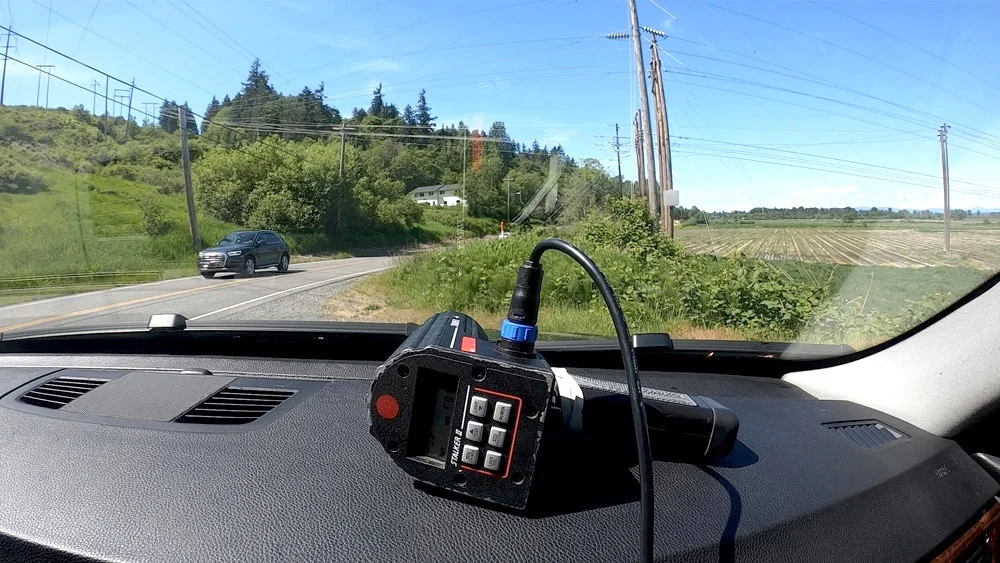 Handheld detector placed on dashboard