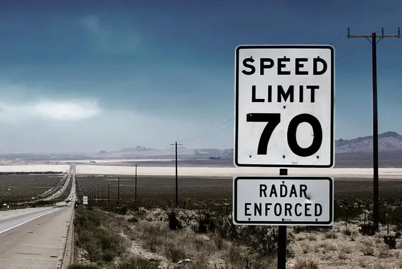 Radar enforced and speed limit warning sign