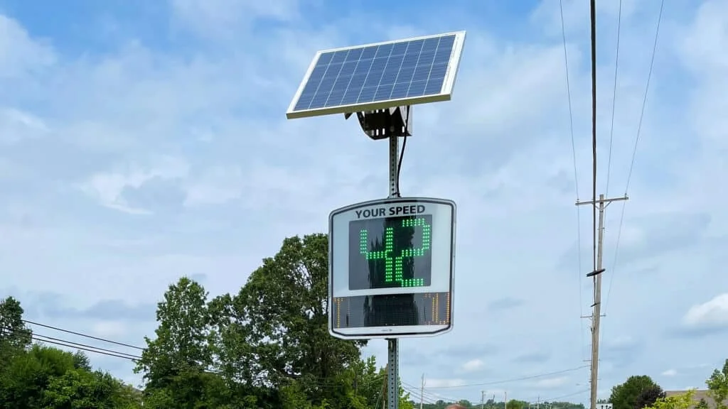 Solar powered speed indicator with green text