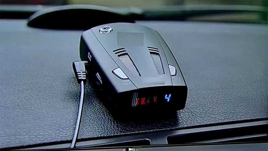 Police radar detector mounted on dashboard