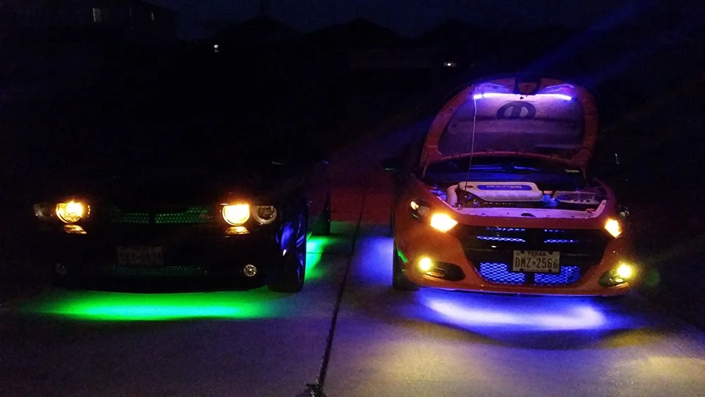 Modified cars sporting neon underglow lights