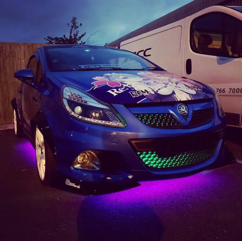 Tuner car with magenta underglow