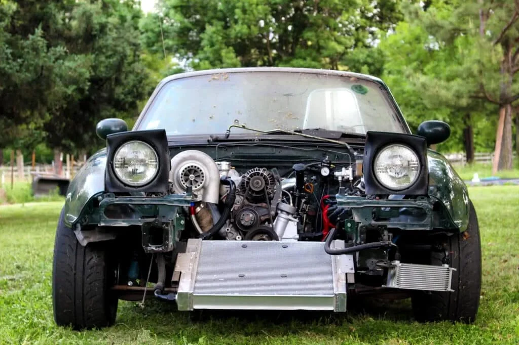 Dual rotor 13B-swapped NA Miata in British racing green