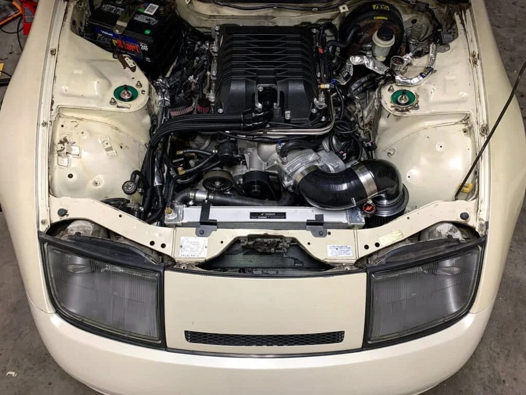 White Nissan 300zx with open hood