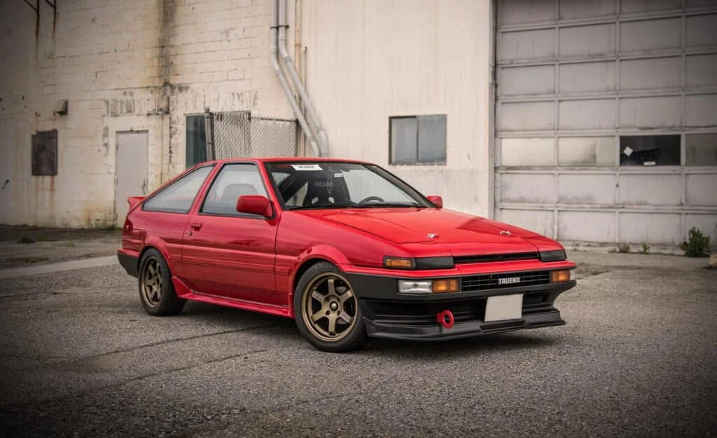 Red Corolla Sport GT-S with gold rims