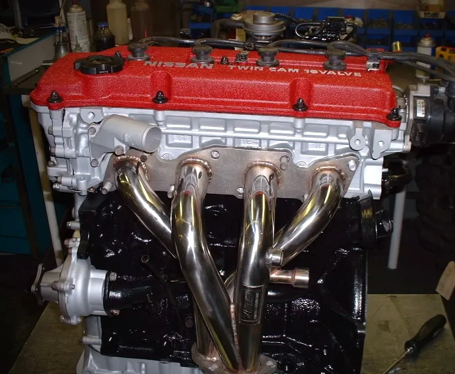 Nissan KA24DE engine with aftermarket headers