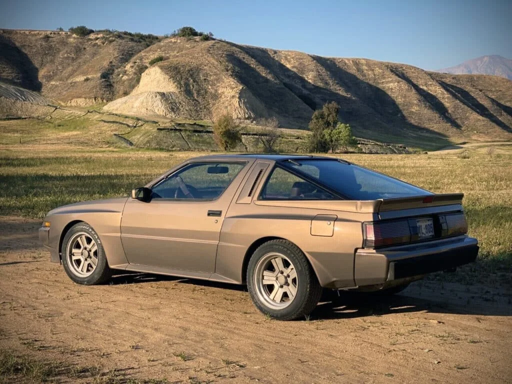 Brown Mitsubishi Starion at a senic location