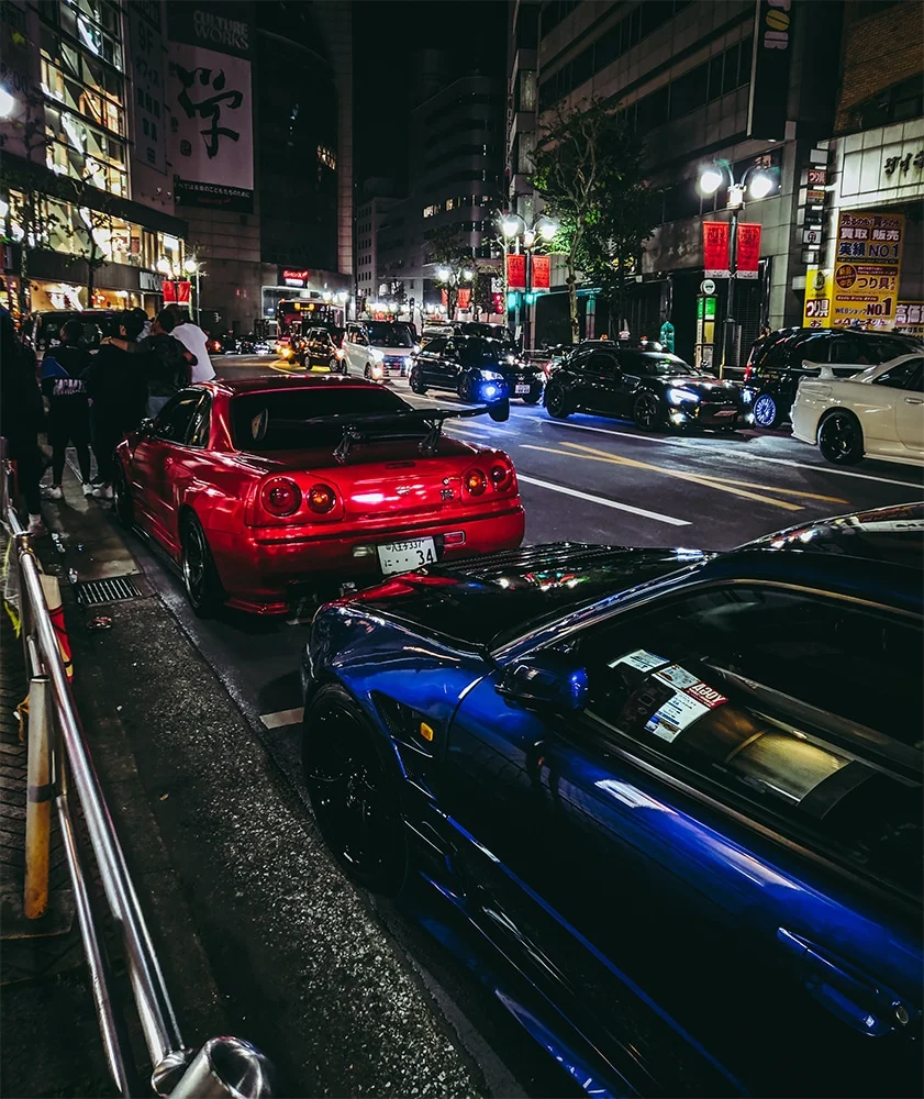 Red R43 Skyline on a neon lit street in Japan