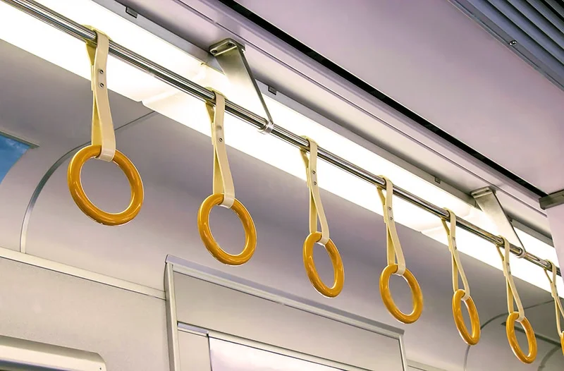 Overhead handles in a Japanese subway