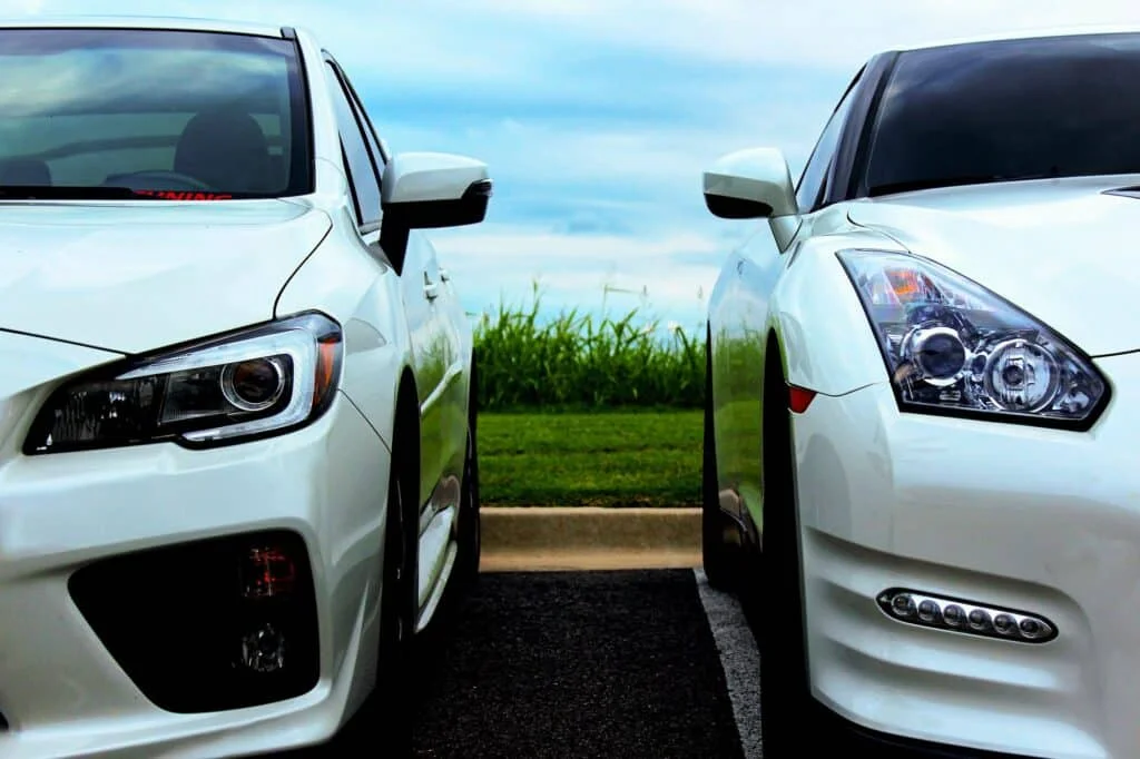 R35 GT-R parked next to a Subaru WRX