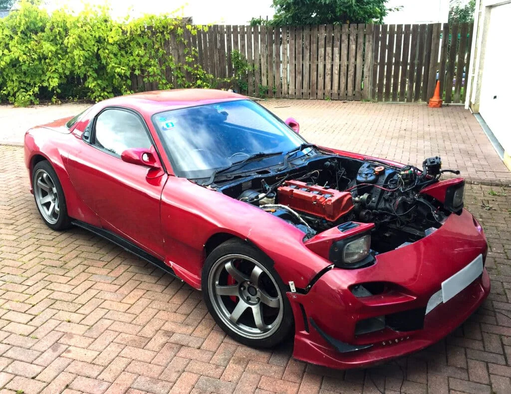 Red Mazda RX-7 with a Honda K24 motor