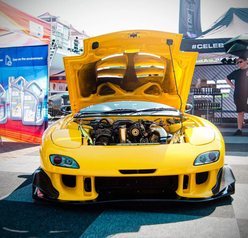 Heavily modified yellow Mazda RX-7
