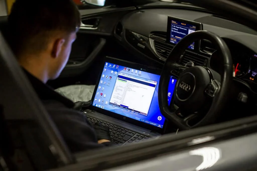 Tuner working on an Audi sedan