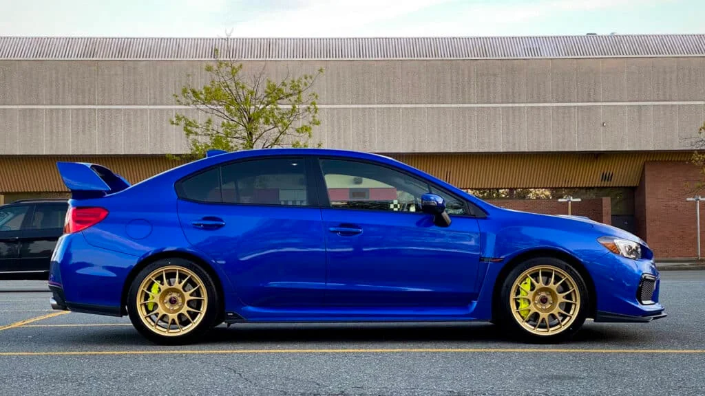Blue WRX with gold BBS rims