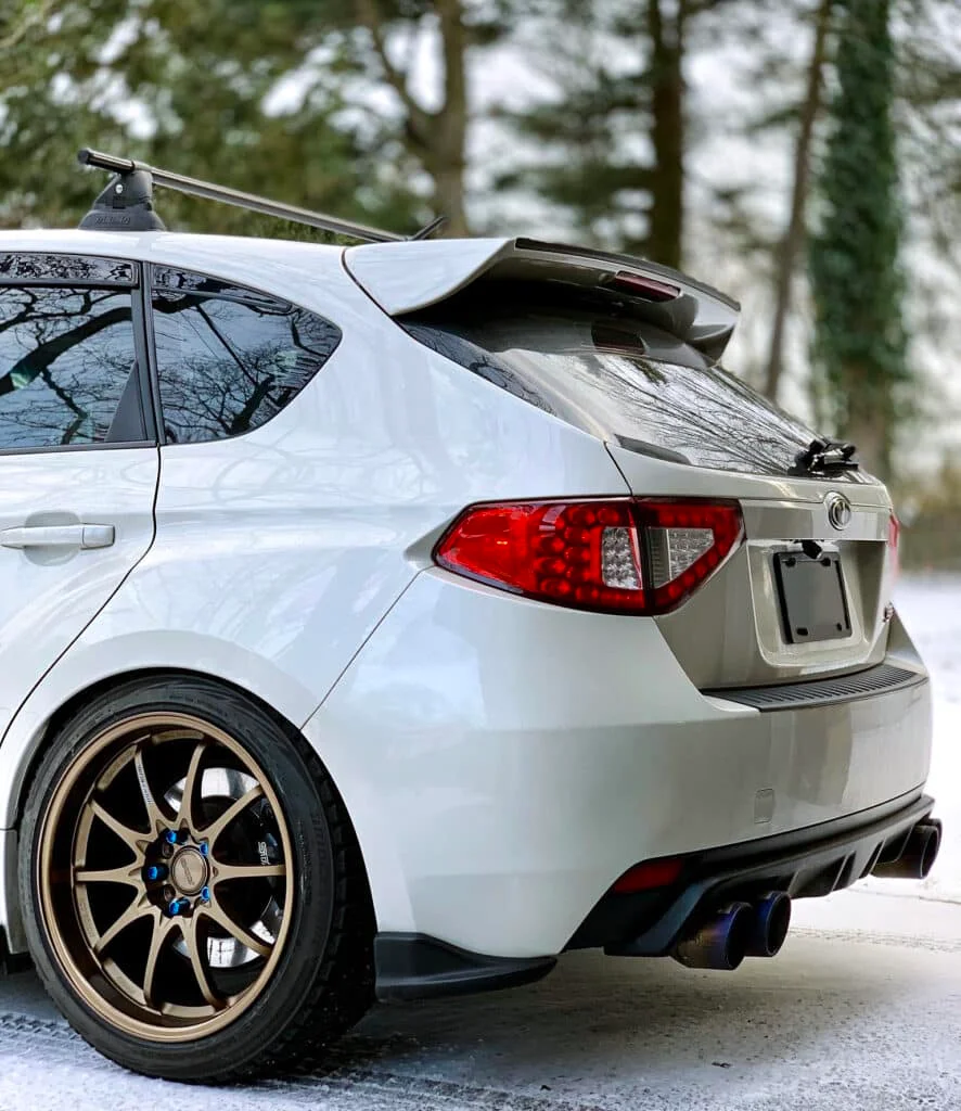 Bronze CE28N with blue dress-studs on a white WRX wagon