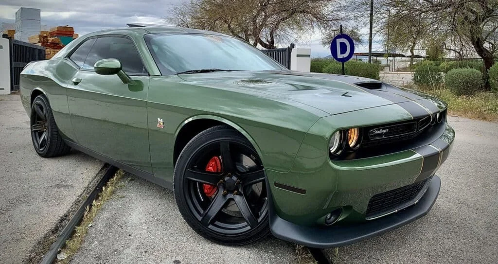 Factory Reproduction Wheels on a forest green Dodge Challenger