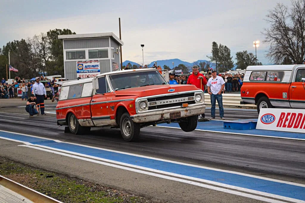 Street Outlaws Farmtruck popping wheelies at a dragstrip