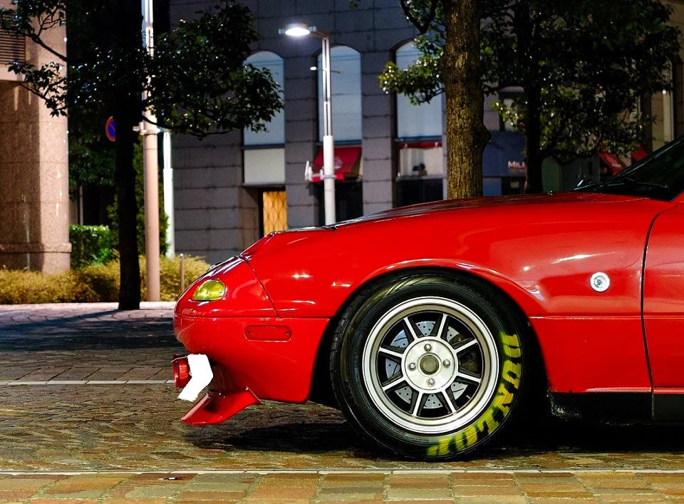 Hayashi Racing Street rims on a red NA Miata