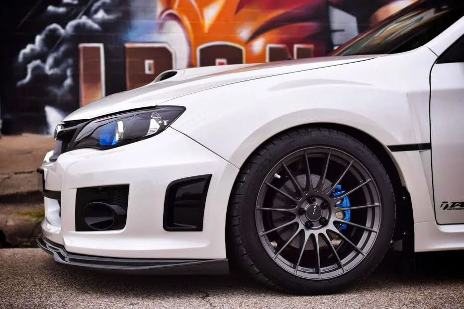 Enkei RS05-RR installed on a white WRX