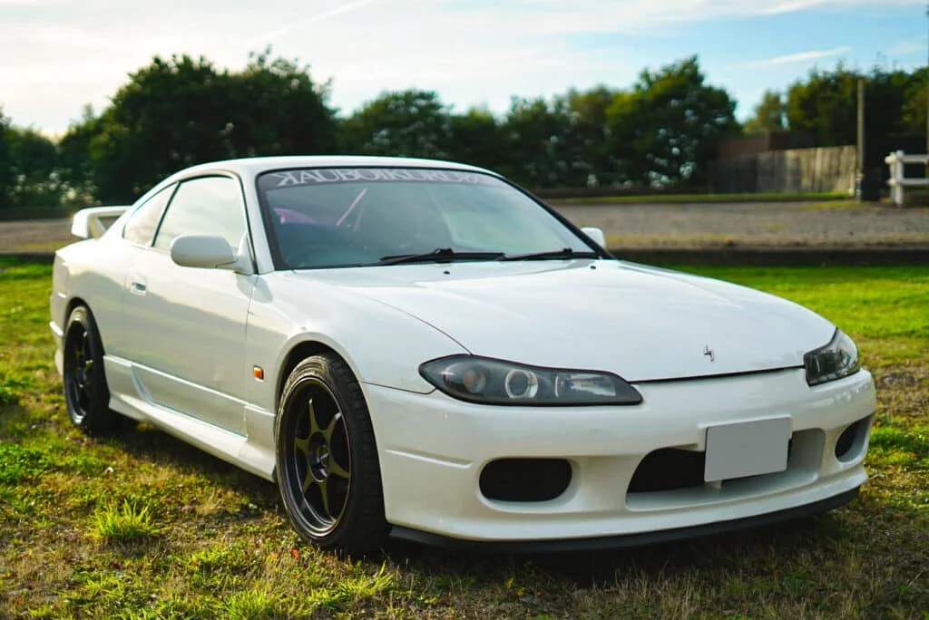 Buddy Club P1 rims on a white S15
