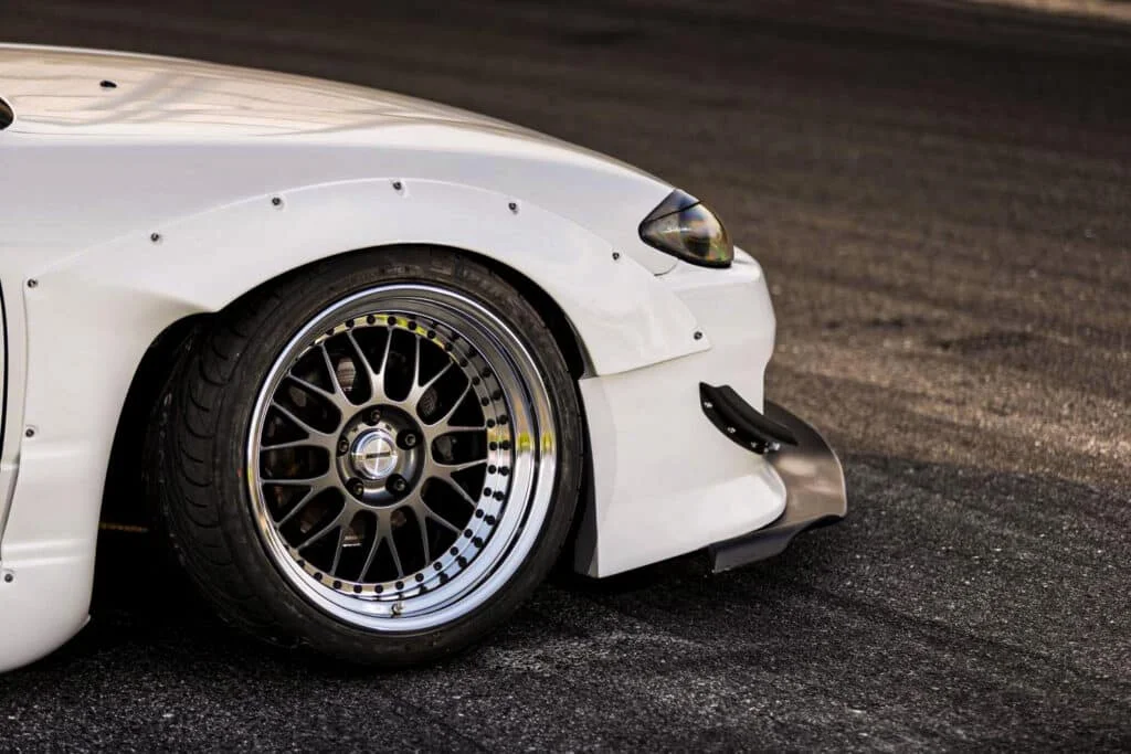 White bimmer with Work wheels
