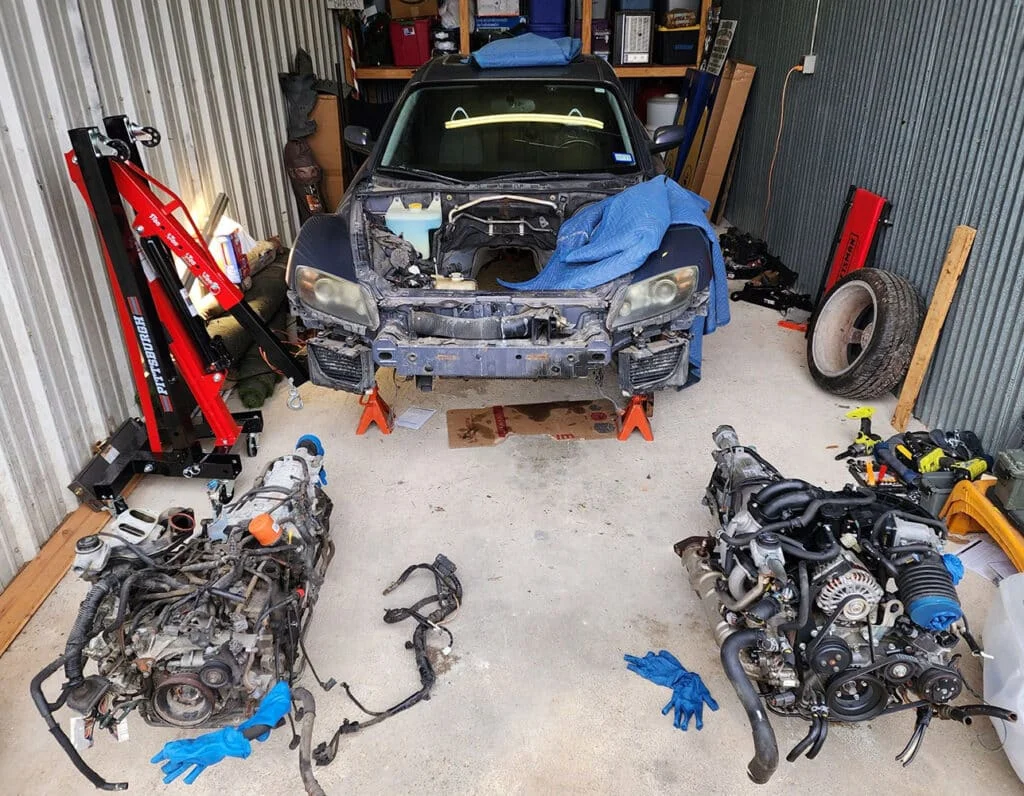 Messy engines on garage floor